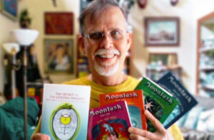 Bruce P. Grether with his books