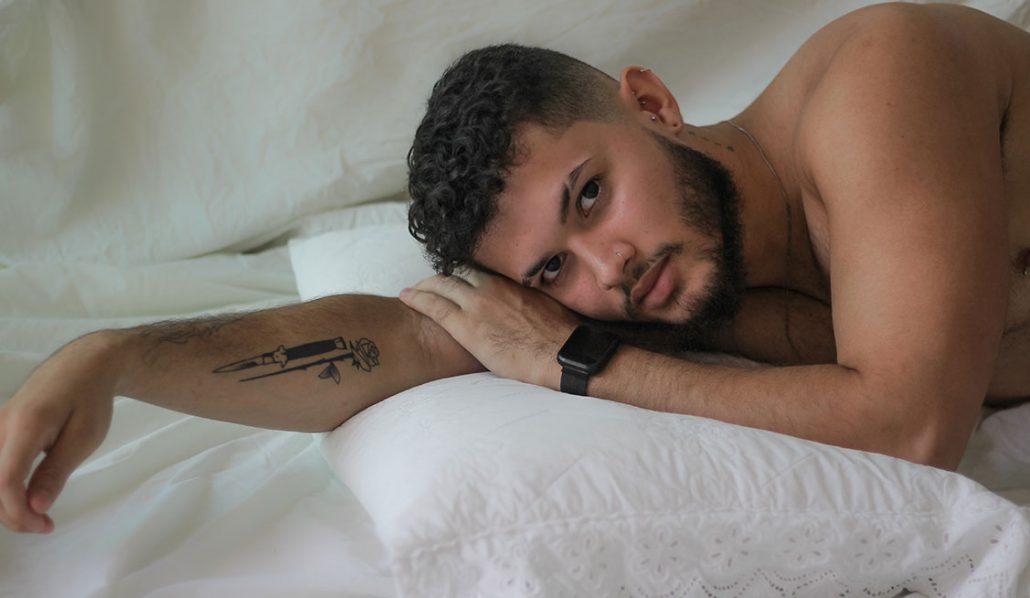 Shirtless man laying on bed - Bator Pride - The Bator Blog
