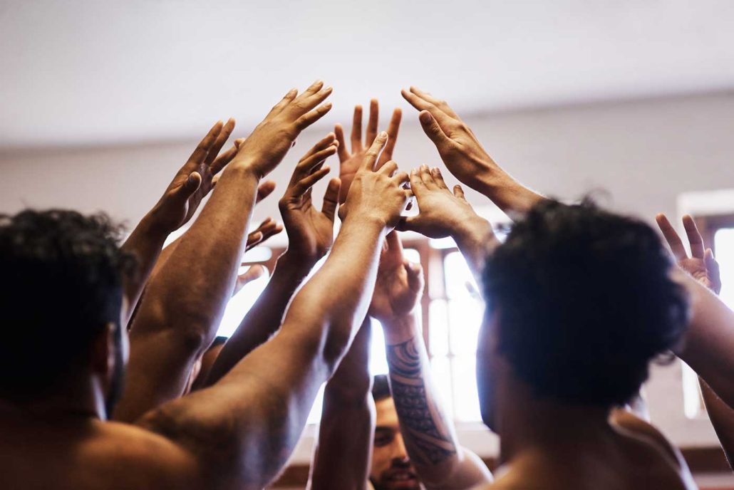 Building Your Mutual Male Masturbation Squad - group of men with hands up in a circle